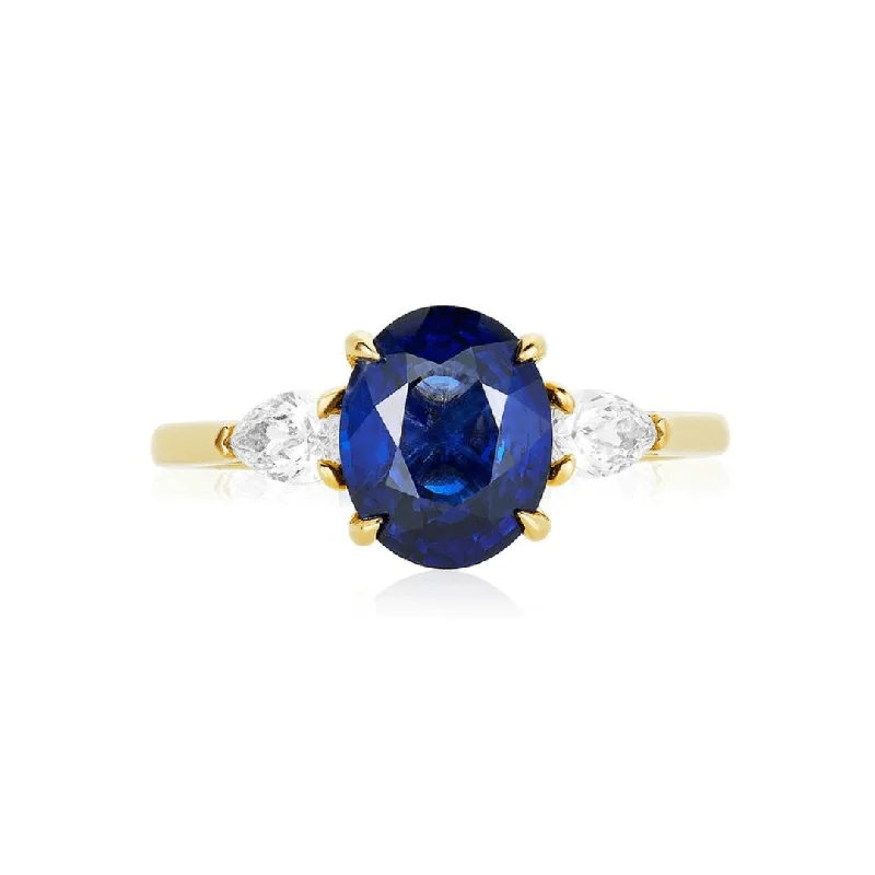 Oval Cut Engagement Rings in Palladium with a Hidden Halo for a Surprise SparkleOval Cut Sapphire with Pear Cut Diamond Side Stones Oval Cut Engagement Rings in Palladium with a Hidden Halo for a Surprise SparkleOval Cut Sapphire with Pear Cut Diamond Side Stones